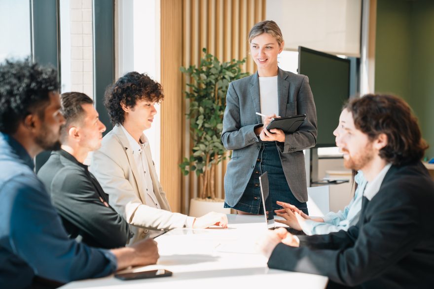 Consultant facilitating a discussion with an executive committee